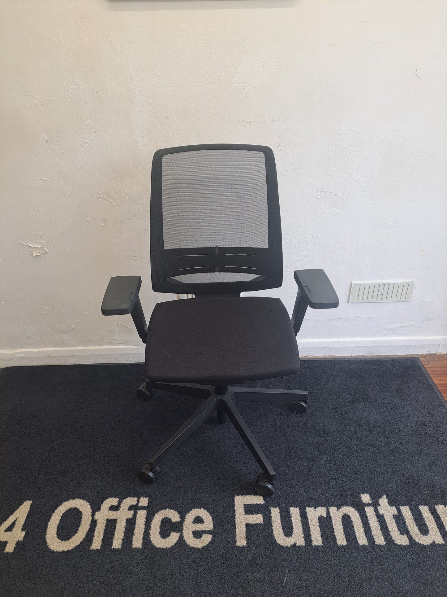 Black mesh fully adjustable operator chairs